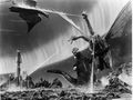 Godzilla, Rodan, and King Ghidorah fighting on the surface of Planet X, with the P-1 in the background