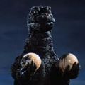 Godzilla holds Hedorah's eyeballs after ripping them from his husk