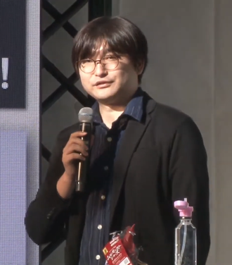 Takuya Uenishi speaking at Godzilla Fest 2022