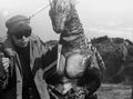 Teruyoshi Nakano instructs Tatsumi Nikamoto, who is wearing the Titanosaurus suit.