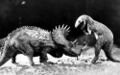 A promotional still of Agathaumas charging an Allosaurus