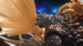 Burning Millennium Godzilla biting King Ghidorah's wing