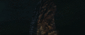 Godzilla's tail face's jaw opens